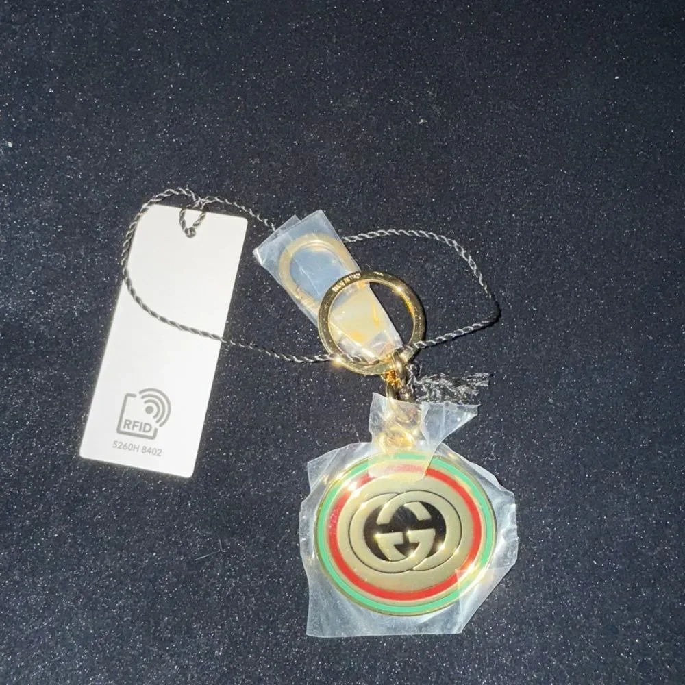 Brand new with box and dustbag Gucci Gold and Green Keychain